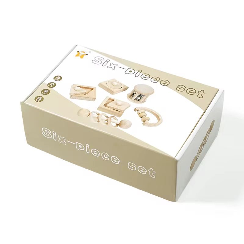 Montessori inspired six piece wooden infant exploration set packaged in gift ready storage box