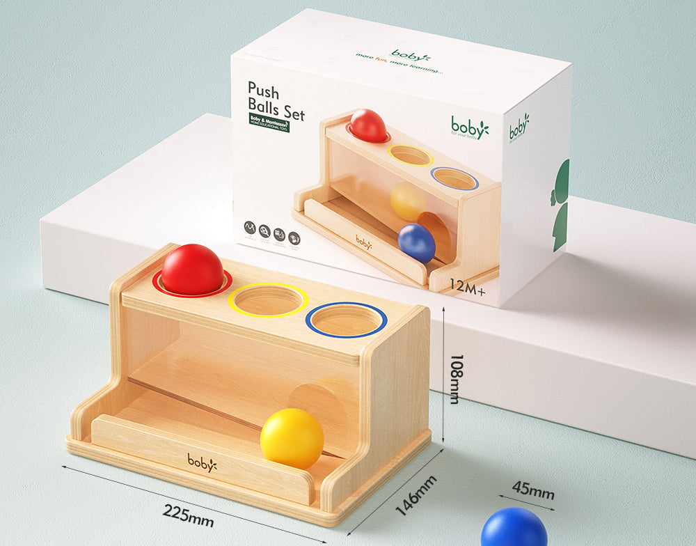 Angled view of a Montessori wooden ball drop box featuring colorful balls and matching openings, encouraging grasping, color matching, problem-solving, and early cognitive development for young children.