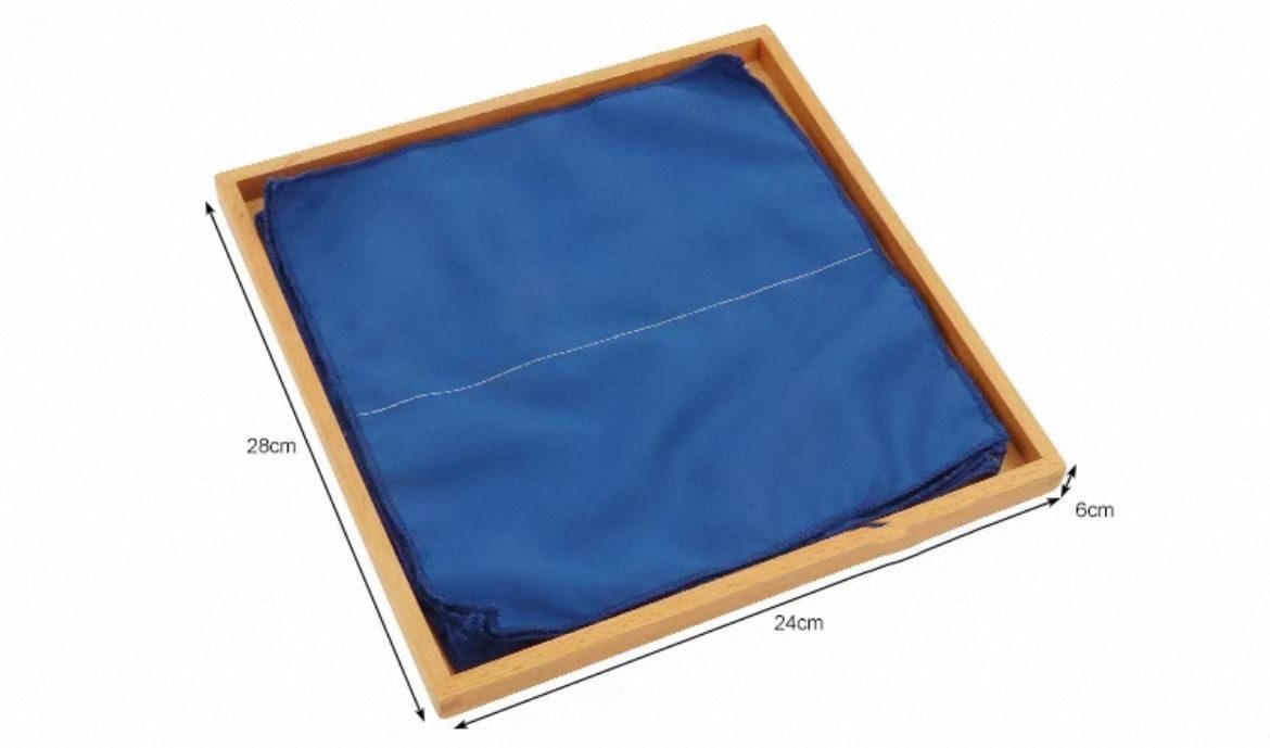 Single Montessori folding cloth displayed in tray for teaching step-by-step folding