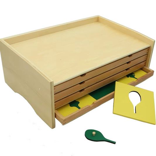 Wooden Montessori botany leaf cabinet closed view with pull-out drawers for leaf inset activities