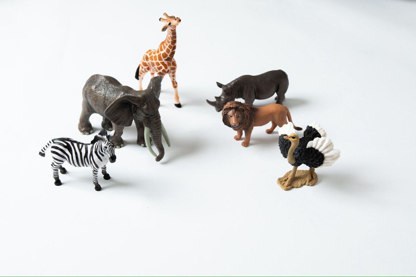 Toddler African animals figurines arranged for open-ended play and Montessori object to picture matching work