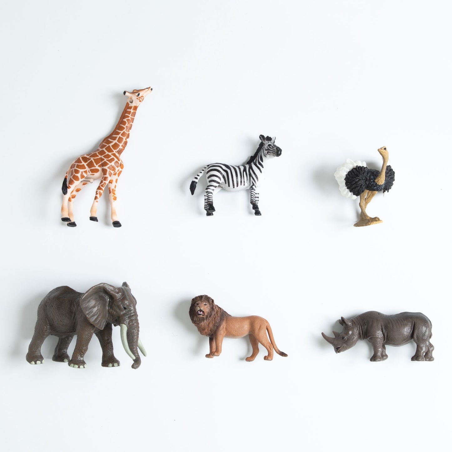Set of African animal figurines including giraffe, zebra, ostrich, elephant, lion and rhinoceros for toddler matching work