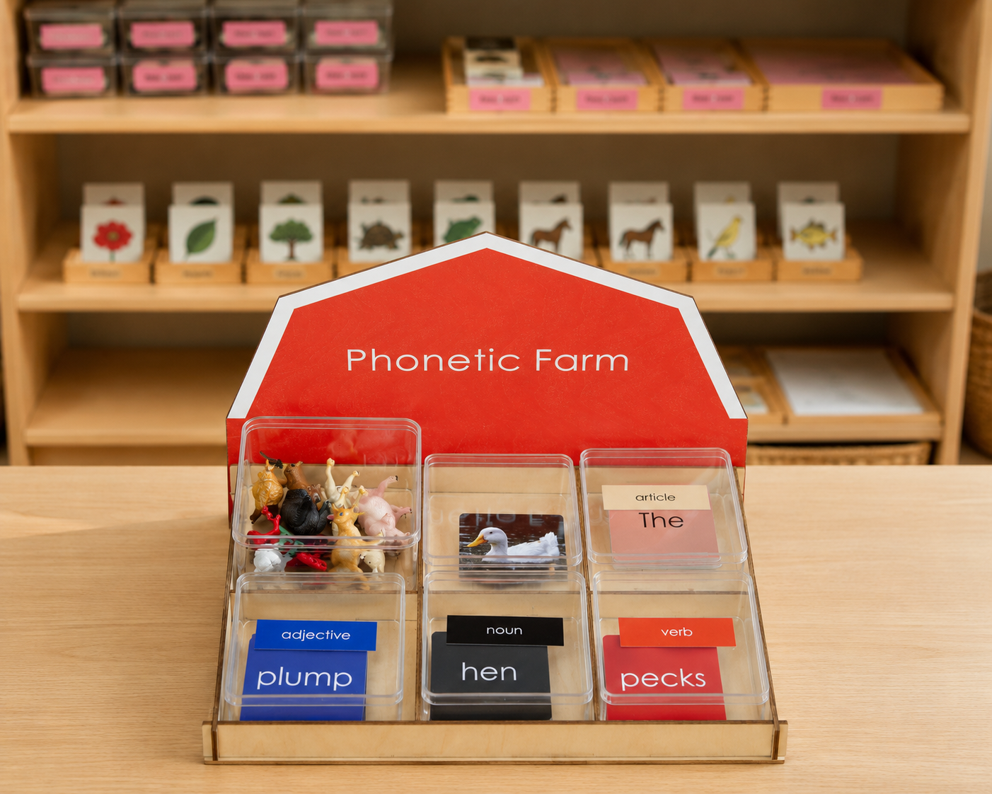 Montessori Phonetic Farm Game wooden barn display stand on a Montessori language shelf with animal figurines and grammar cards