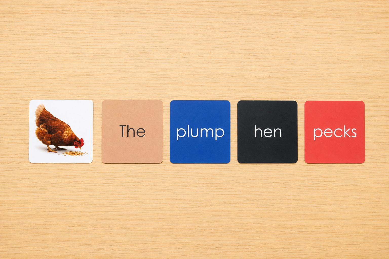 Montessori Phonetic Farm Game colour-coded sentence cards showing the plump hen pecks