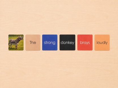 Montessori Non-Phonetic Farm Game colour-coded sentence cards showing the strong donkey brays loudly with donkey figurine