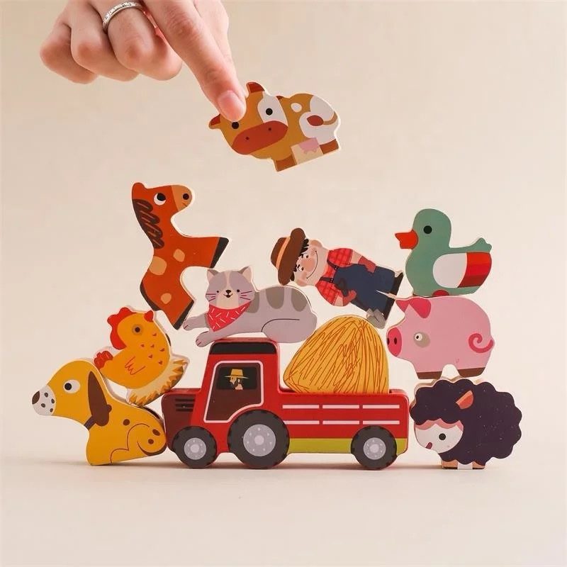 Wooden farm animals stacked on tractor for toddler balance problem solving and creative play