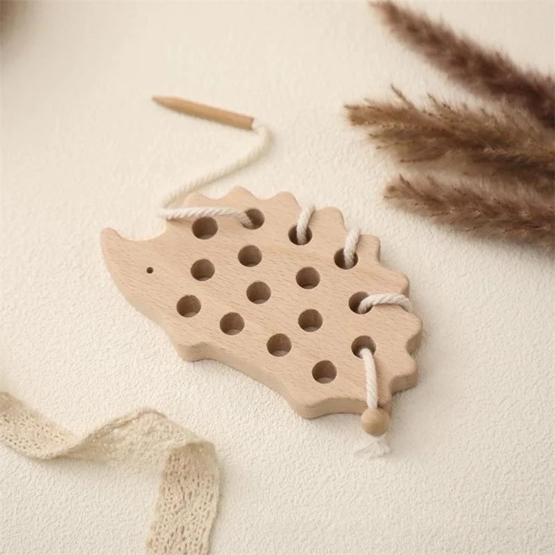 Natural wooden hedgehog lacing toy with thread for Montessori fine motor learning