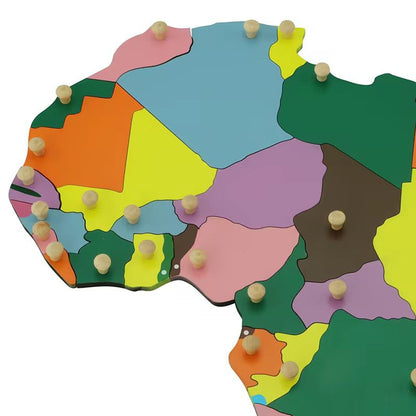 Close-up view of Montessori Africa puzzle map highlighting individual country pieces with wooden knobs for fine motor skills
