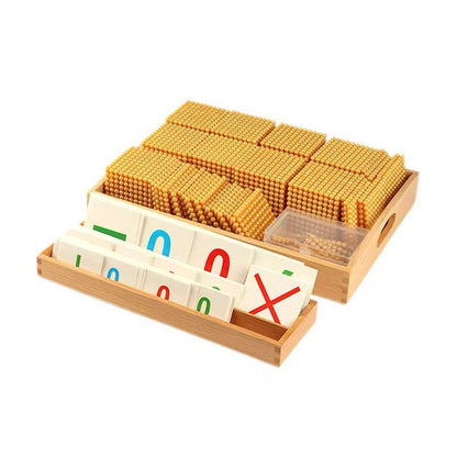 Montessori Bank Game set with golden beads, unit bars, hundred squares, thousand cubes, and place value cards arranged in wooden trays
