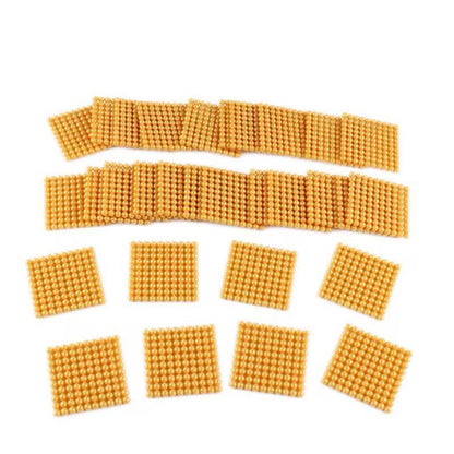 Montessori golden bead hundred squares arranged neatly for math operations and place value learning