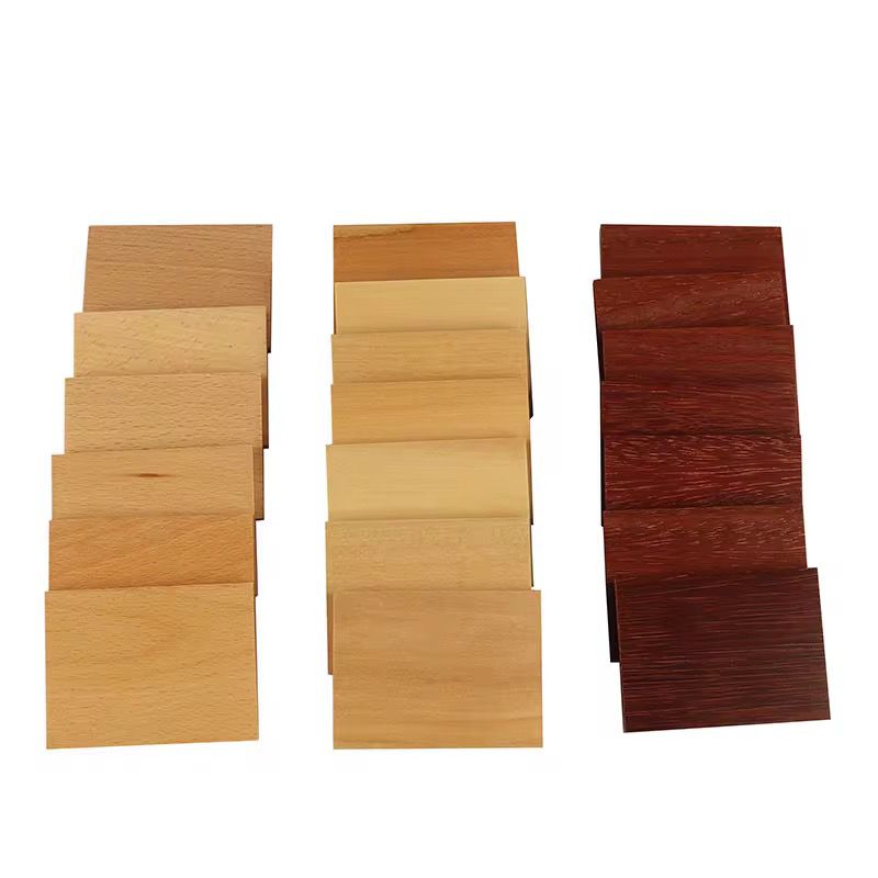 Complete set of Montessori baric tablets showing three groups of wooden tablets in light, medium, and dark shades for pressure and weight discrimination activities.