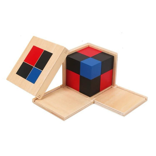 Montessori Binomial Cube displayed in an open wooden box with colored blocks arranged inside