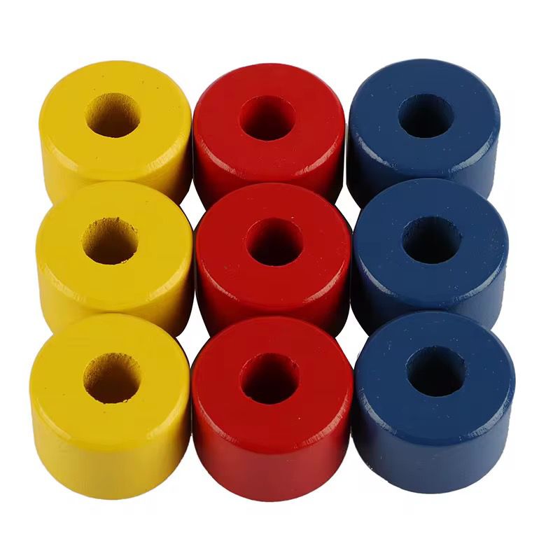 Montessori wooden colored discs in red yellow and blue for toddler stacking and visual color discrimination activity