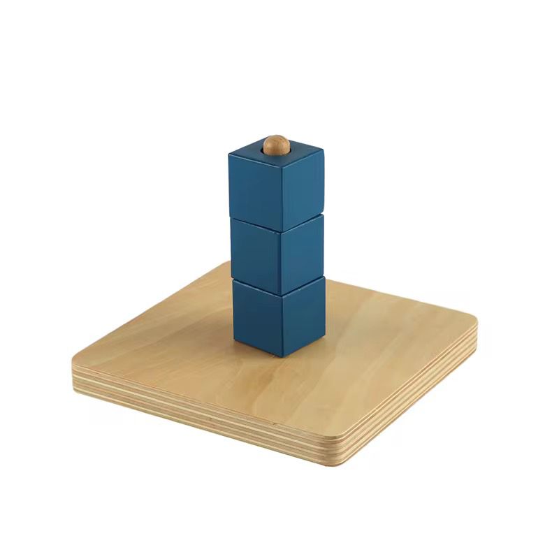 Montessori cubes on vertical dowel stacked for toddler fine motor coordination and controlled hand movement