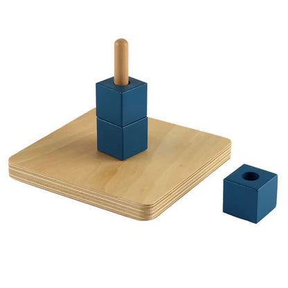 Montessori vertical dowel with blue wooden cubes showing removable stacking activity for toddler hand eye coordination