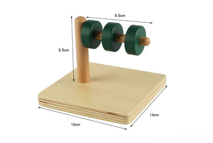 Montessori discs on horizontal dowel showing size dimensions for toddler fine motor coordination and controlled movement
