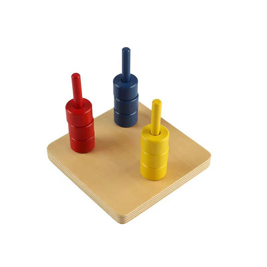 Montessori discs on three colored dowels with red yellow and blue stacks for toddler fine motor coordination and color sorting