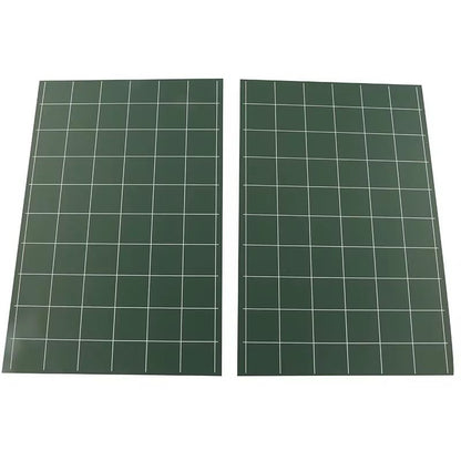 Pair of Montessori chalkboards displaying a full square grid layout for practicing spatial alignment and handwriting.
