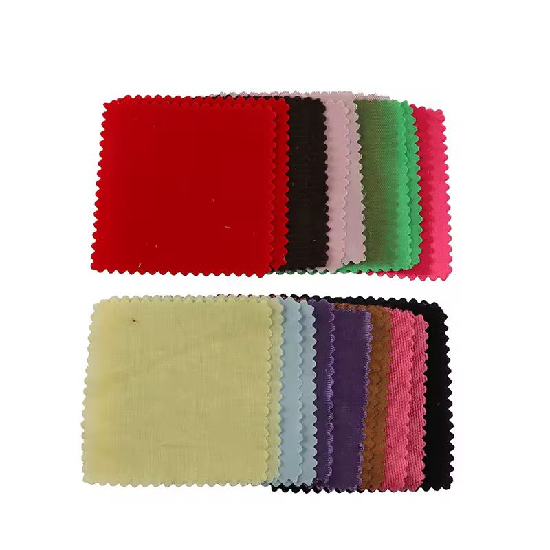 Stacked set of colorful textured fabric swatches used for Montessori tactile discrimination activities