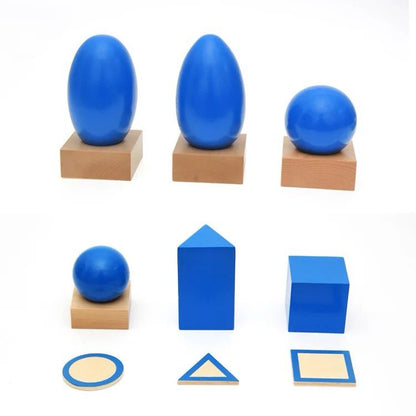Montessori geometric solids placed on wooden bases with 2D matching cards for shape identification