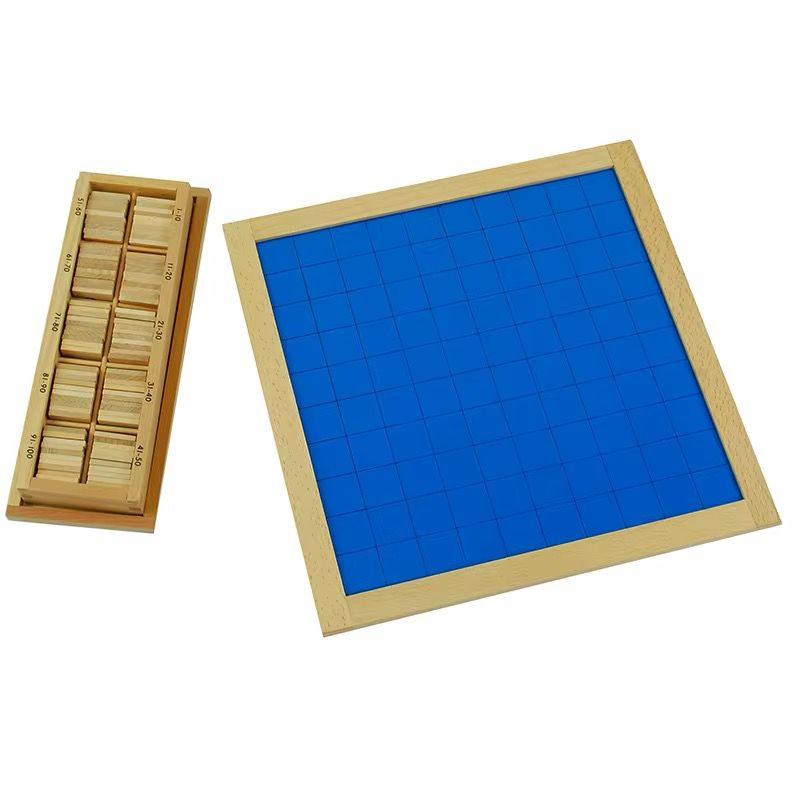 Empty blue Montessori Hundred Board grid placed beside wooden box containing number tiles