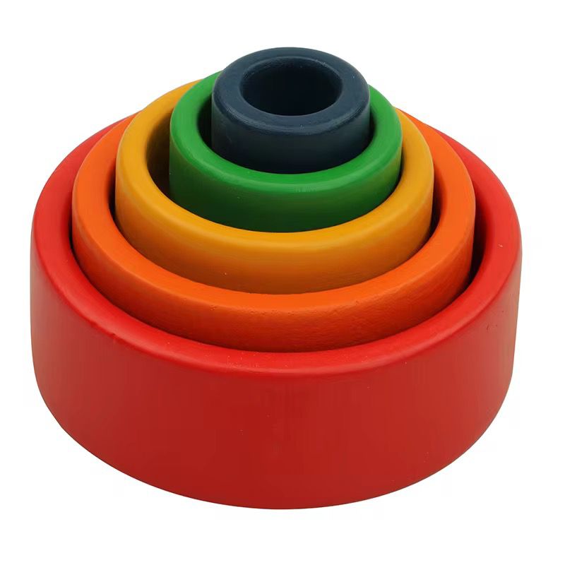 Montessori nesting bowls stacked inside each other for toddler sensorial exploration and dimension awareness
