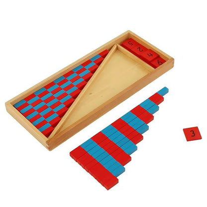 Red and blue Montessori number rods placed inside a triangular wooden storage section with number tiles set aside.