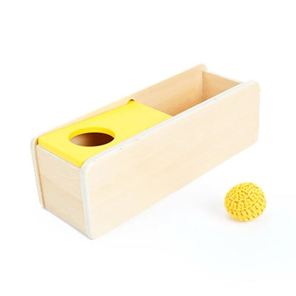 Montessori object permanence box with sliding top and knit ball for infant fine motor control and early object tracking