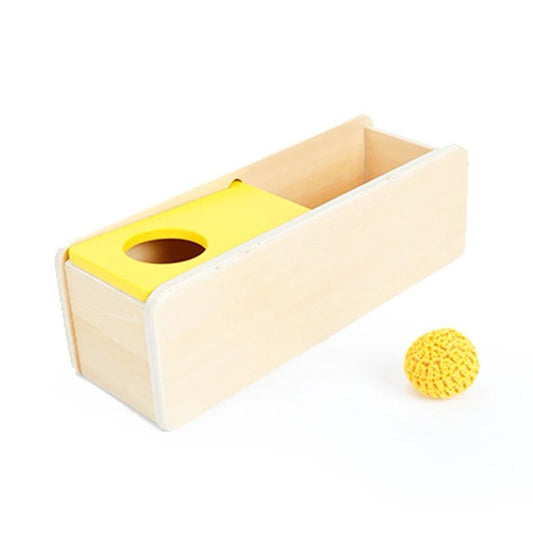 Montessori object permanence box with sliding top and knit ball for infant fine motor control and early object tracking