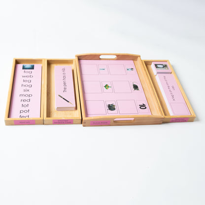 Montessori Pink Series wooden tray with sentence-building cards and picture-word matching material.