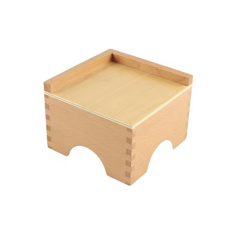 Wooden Montessori pink tower stand used as a display base for sensorial learning activities
