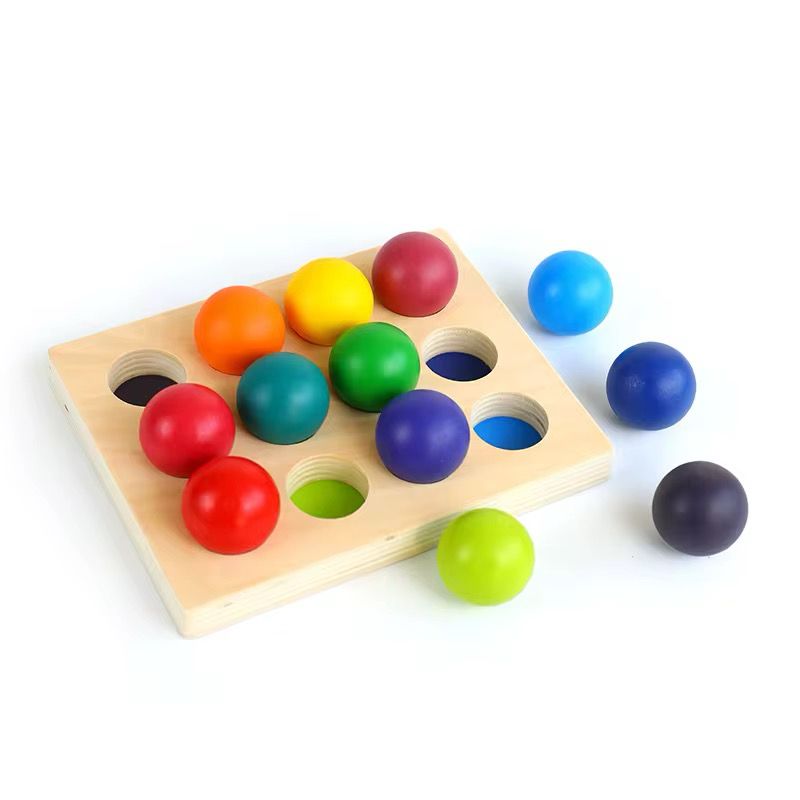 Montessori wooden rainbow ball sorting board with multicolor balls for toddler color matching and fine motor coordination