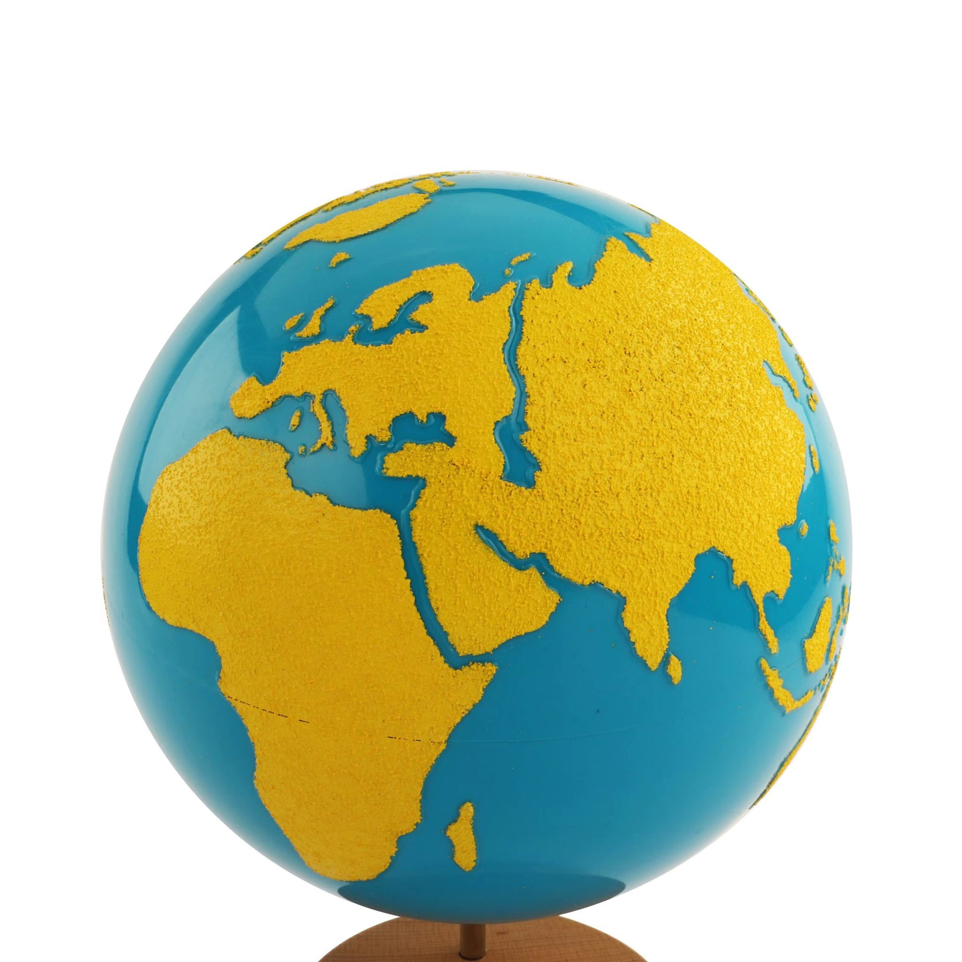 Close-up view of Montessori sandpaper globe showing raised sandpaper continents and blue smooth oceans for sensorial exploration
