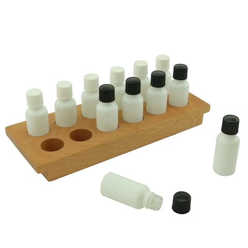 Montessori smelling bottles set with wooden tray and white and black-cap bottles