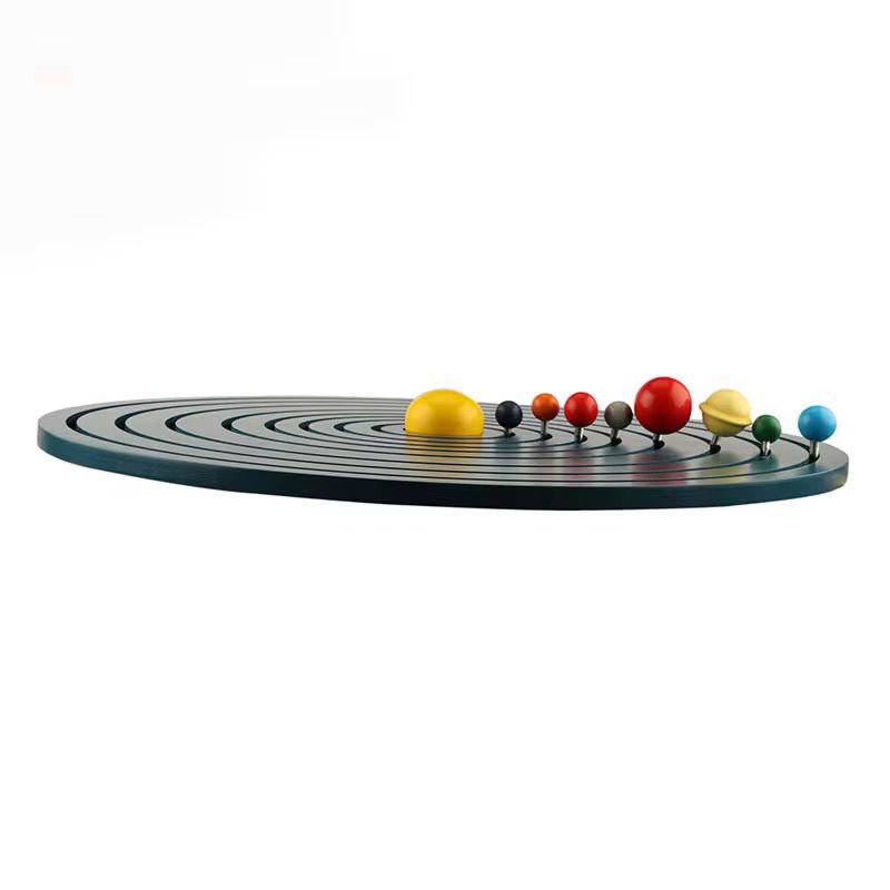 Side view of Montessori solar system board displaying raised wooden planets mounted on metal rods along orbital paths