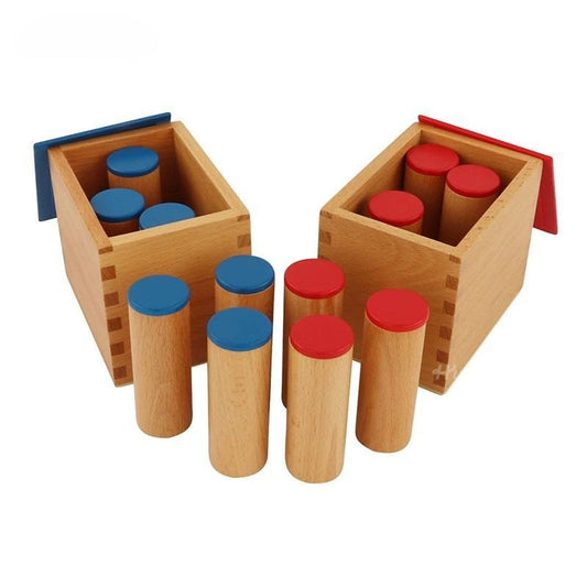 Montessori sound boxes with blue and red lids for auditory discrimination and sensorial learning in early childhood classrooms
