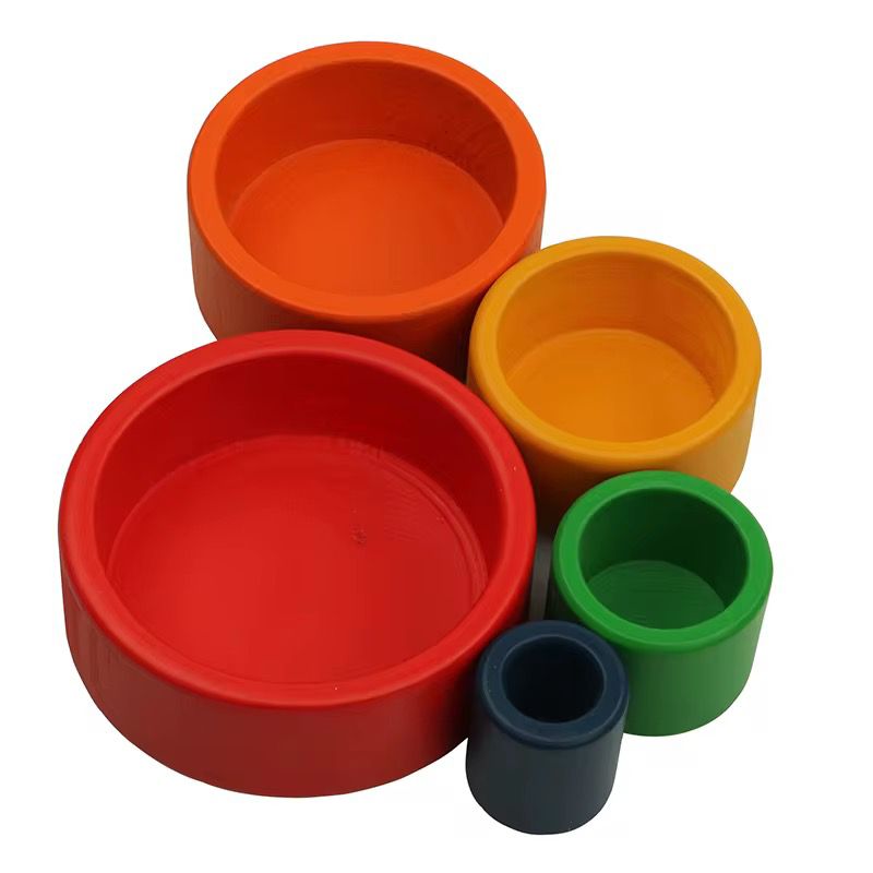 Montessori wooden stacking bowls separated by size for toddler visual discrimination and fine motor development