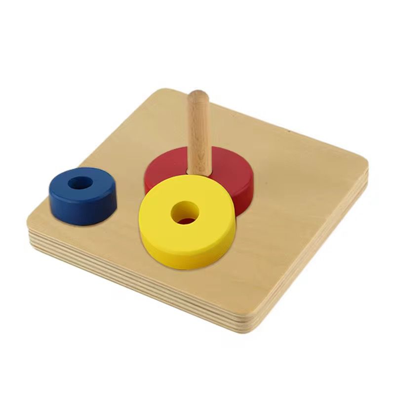 Montessori vertical dowel with loose stacking discs for toddler hand eye coordination and size discrimination