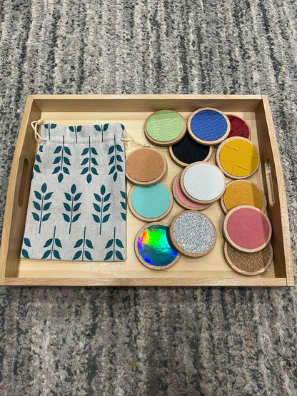 Wooden tray with Montessori tactile texture discs for matching and sensory play