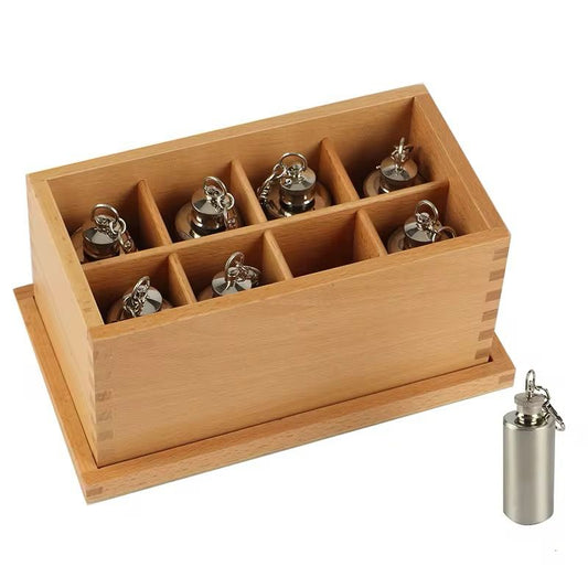 Montessori Thermic Bottles set displayed in a wooden compartment box for temperature discrimination activities.
