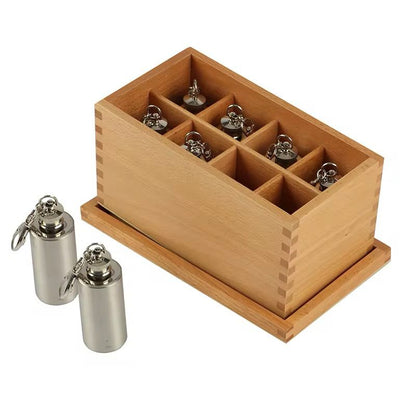 Top view of Montessori Thermic Bottles neatly arranged inside the wooden sorting box.