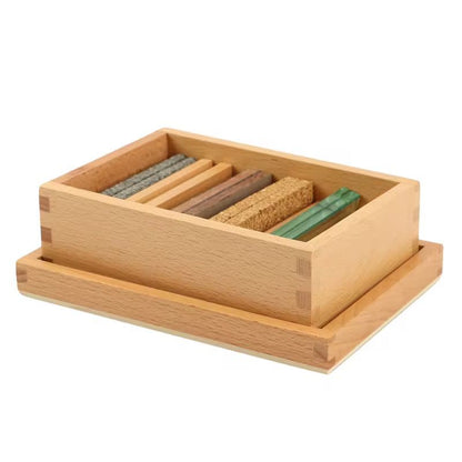 Montessori thermic tablets set arranged inside a wooden storage box