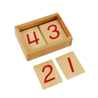 Wooden Montessori number cards 0–9 displayed with a wooden storage box.