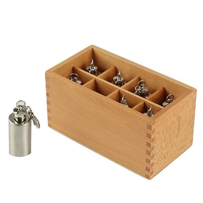 Single thermic bottle placed beside the Montessori wooden storage box