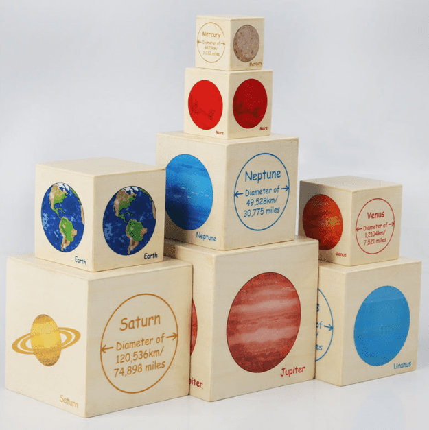 Solar system stacking cubes featuring planet illustrations with diameter information to support space and science learning