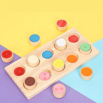 Wooden Montessori sensory texture board with colorful textured cylinders displayed on a bright background.