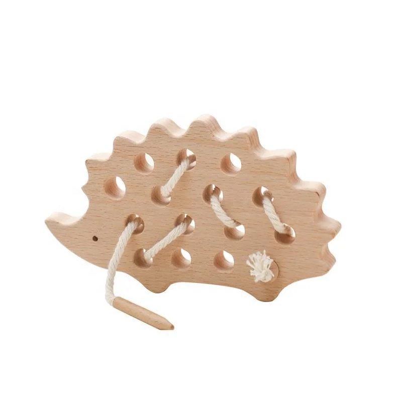 Wooden hedgehog lacing toy with holes and cotton thread for toddler hand coordination