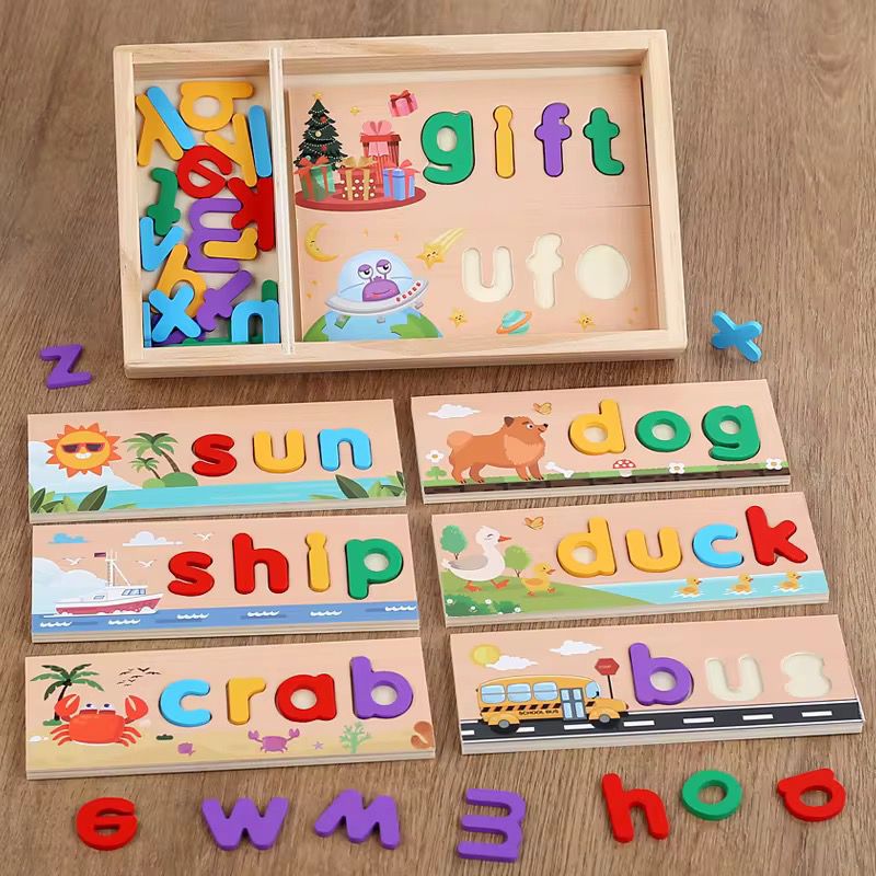 Wooden spelling puzzle set showing various word boards such as gift, ufo, sun, ship, duck, and bus with colorful letters