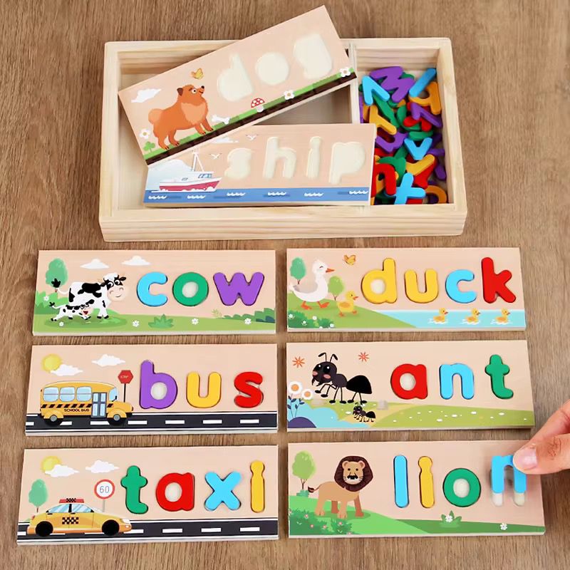 Wooden spelling puzzle set with colorful lowercase letters and word boards including dog, ship, cow, duck, bus, taxi, and lion