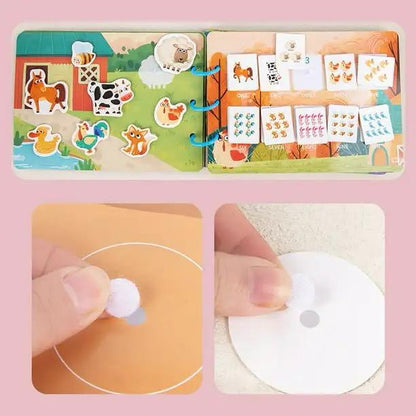 Toddler using farm and dino busy book for hands-on learning activities